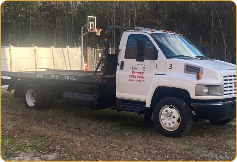Owner-operated Barnes Auto & Towing flatbed truck in Charles City, Virginia